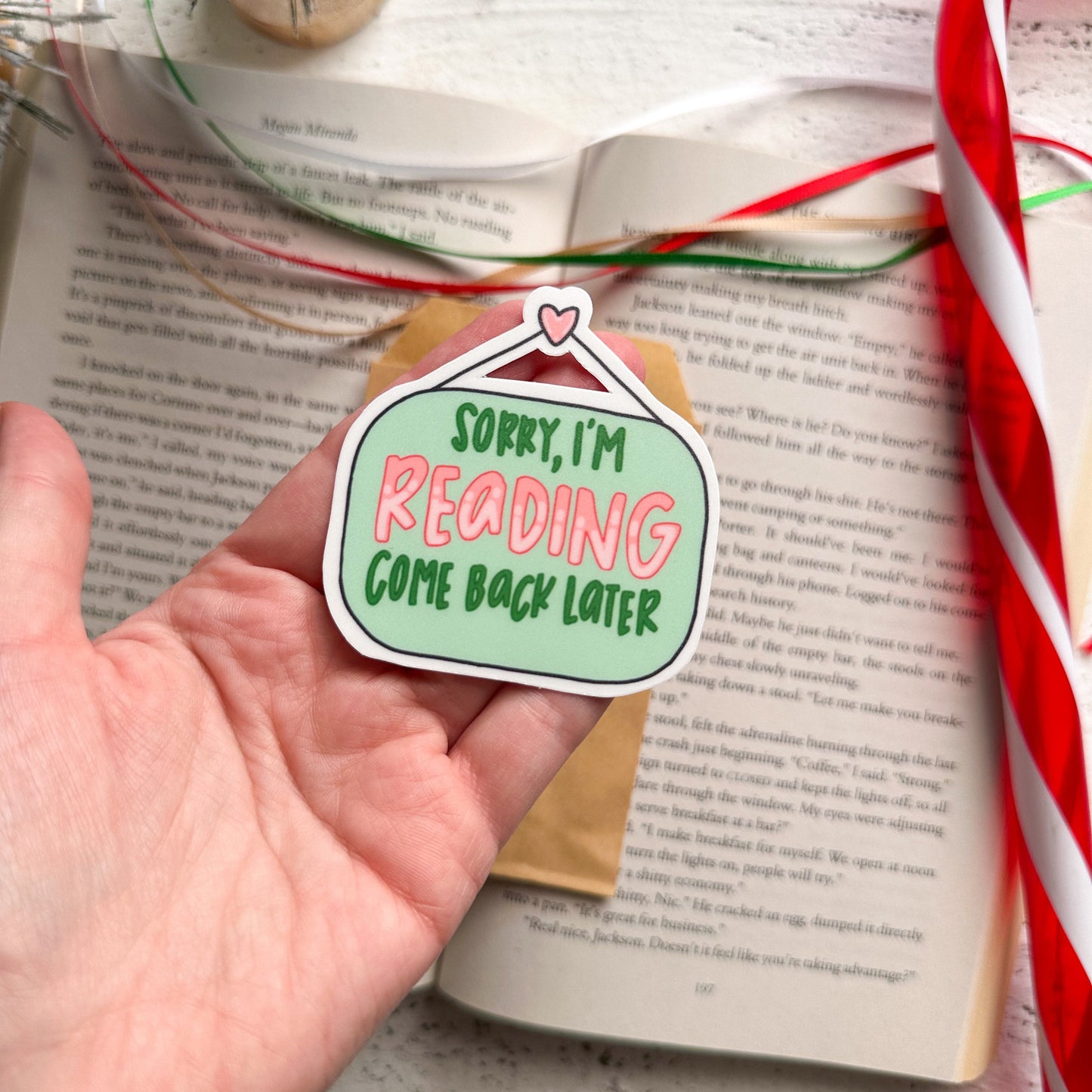 Sorry, I'm reading, come back later sticker