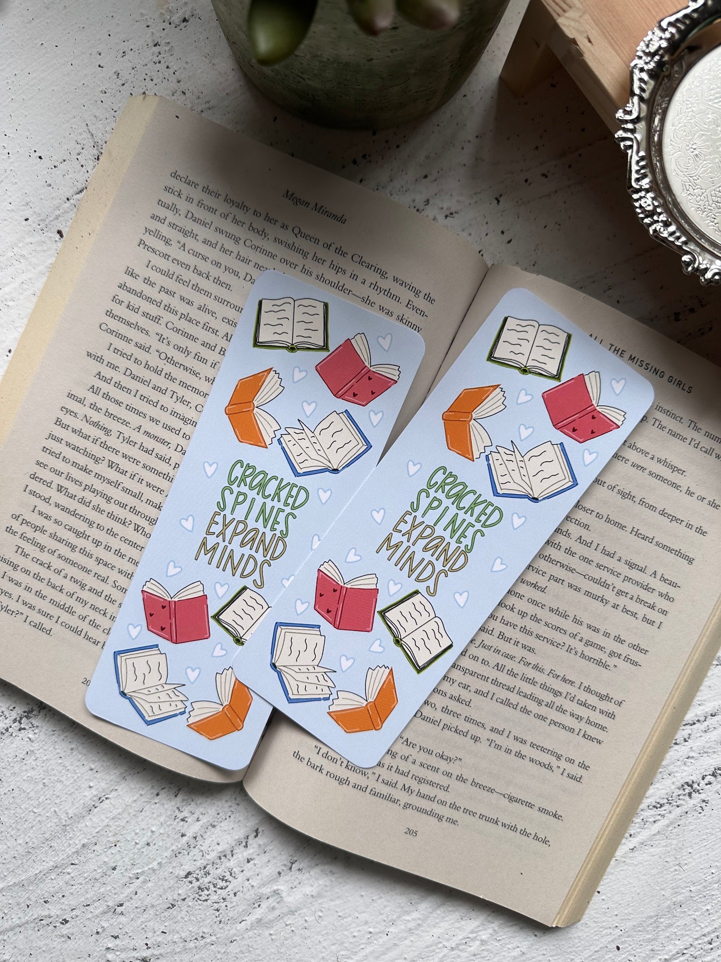 Cracked Spines Expand Minds Bookmark